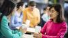 Two women discuss English courses at the British Council Vietnam